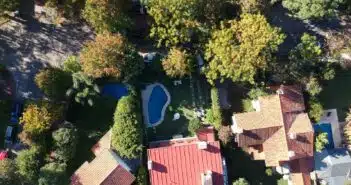 aerial view of houses near trees during daytime